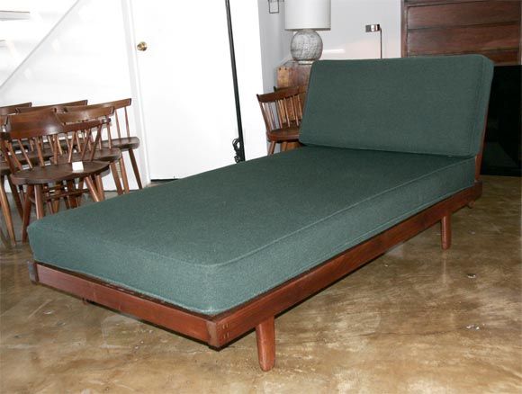 Exceptional George Nakashima spindle-back daybed. Beautiful and rare, upholstered in original green material.