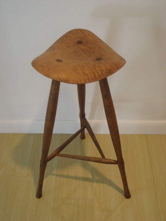 This beautiful three-leg stool, with through-tenon construction, was one of ten made as gifts by Wharton Esherick for his friends in the 1940's. Rare and stunning!
