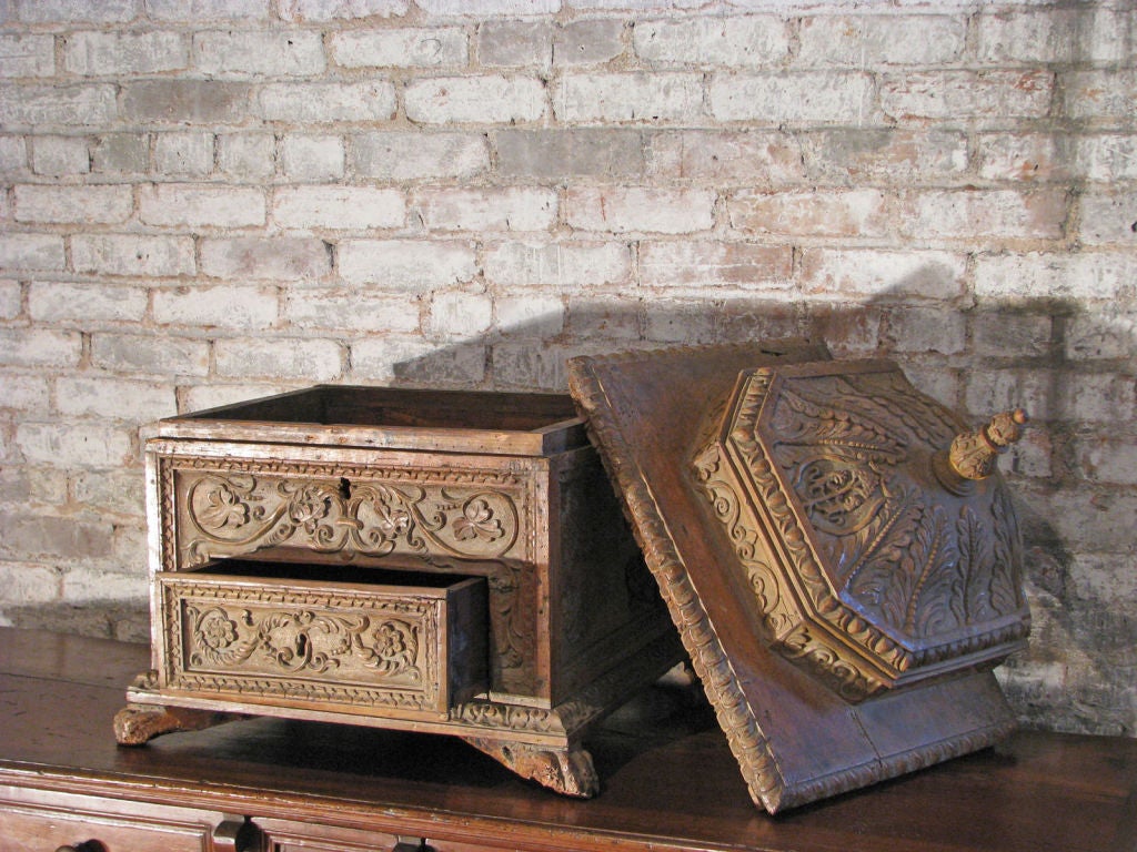 Unusual carved box with a dome top cover and one-drawer.
Nice dried out light color.

