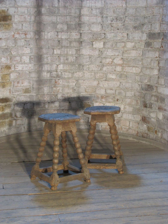 Charming pair of small stools, bobbin turned legs, joined by box stretchers, octagonal tops, beautiful worn and dried out look.
