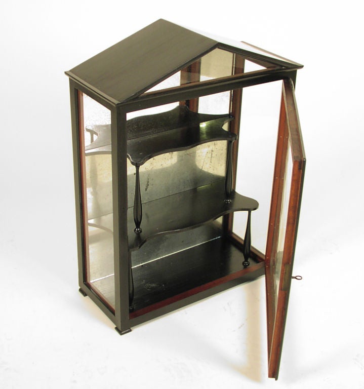 Austrian Biedermeier Ebonized Small Display Cabinet with Original Shelves and Mirrored Back.