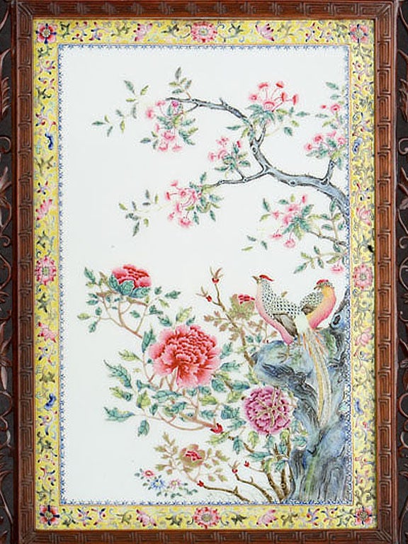 Famille Rose Enamelled Porcelain Plaque Decorated with Tree Peonies and a Pair of Chinese Golden Pheasants sitting on a Flowering Tree, Encased in a Rosewood Through-Carved Frame and Stand