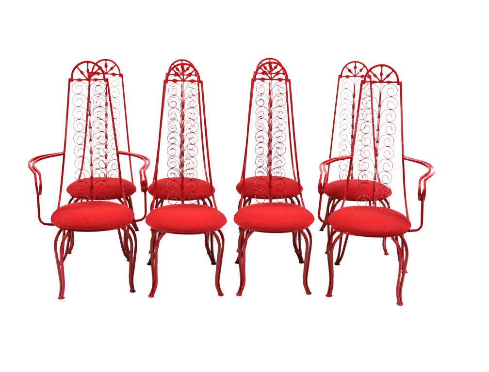 Set of eight heavy wrought iron red scroll chairs, circa late 1960s. Feature ornate scrolled iron high backs with new sunbrella upholstery and new powder coated finish. Can be used inside or out. Six side chairs and two arm chairs available.