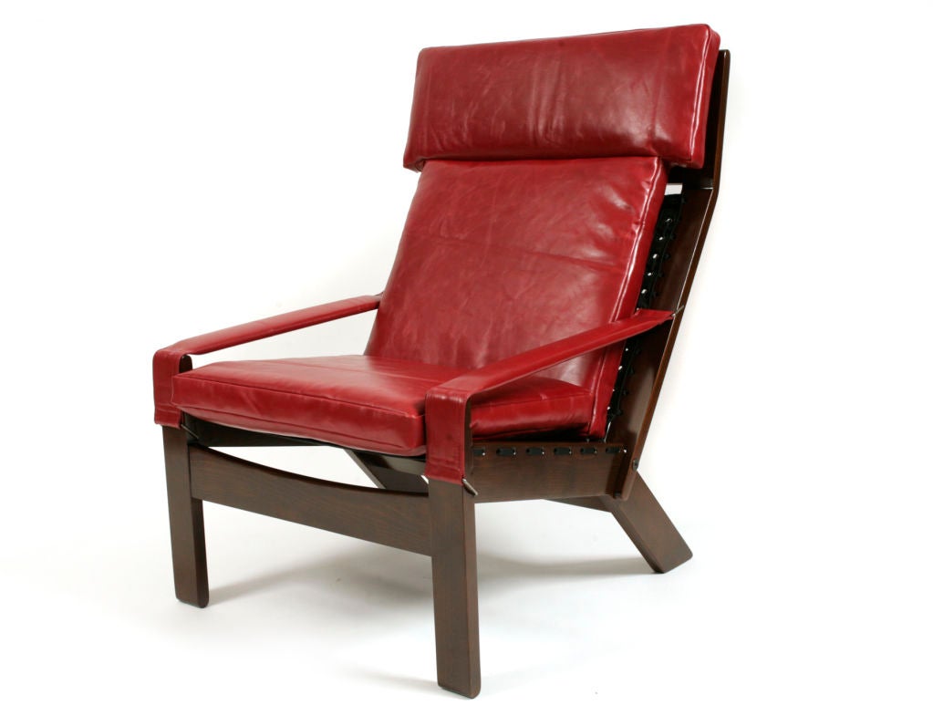 Solid Jacaranda wood adjustable Brazilian lounge chair and ottoman, circa early 1970s. Features high back angular back with new candy apple red leather upholstery and new cording. Newly refinished these pieces have been flawlessly restored.