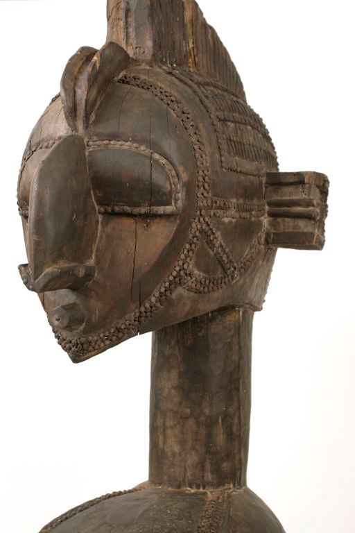 Early 20th century Baga 'Limba' shoulder mask. This piece weighs approximately 120 pounds and stands over six feet tall. It was carried and danced by the tribe's strongest dancer and is a figure representative of fertility and birth. This Baga piece
