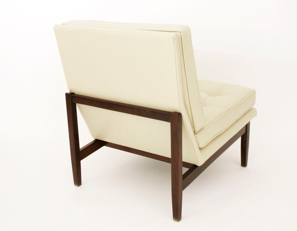 Pair of Florence Knoll parallel bar chairs circa early 1960's. These models were produced only in Brazil and are done in solid rosewood and leather. Excellent restored condition. Price is for the pair.