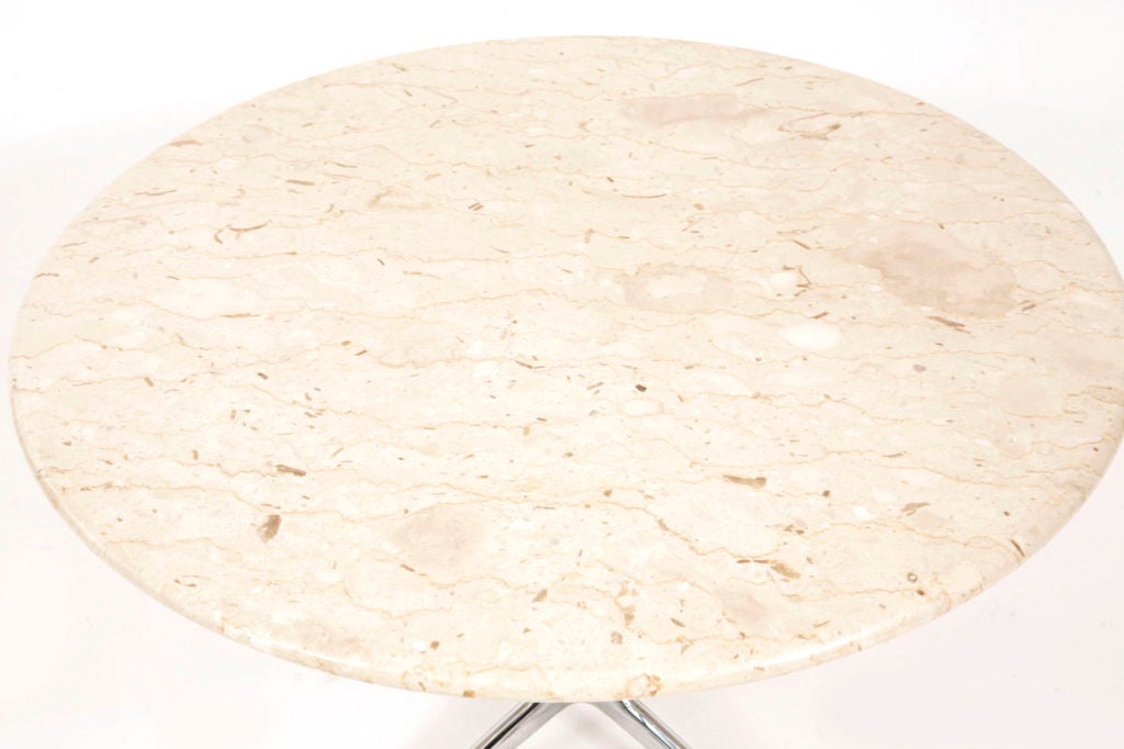 Round La Fonda table with marble top by Charles and Ray Eames for Herman Miller circa early 1960's.  Features beautiful cream marble with soft butterscotch veining and iconic chrome plated steel la fonda base.