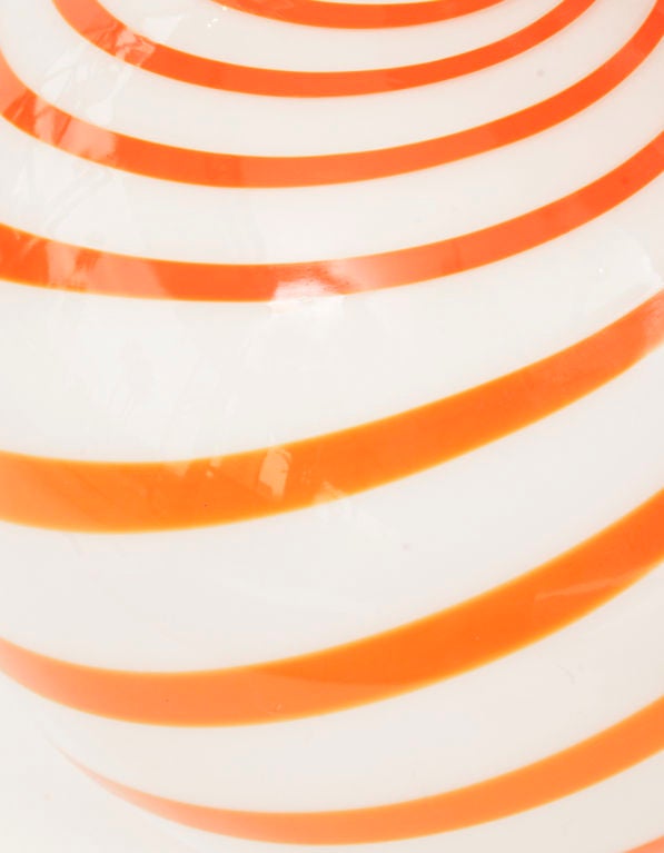 Hand blown murano glass globe lamp from Italy circa early 1960's. Features striking orange swirls through the round white body. Excellent original condition.
