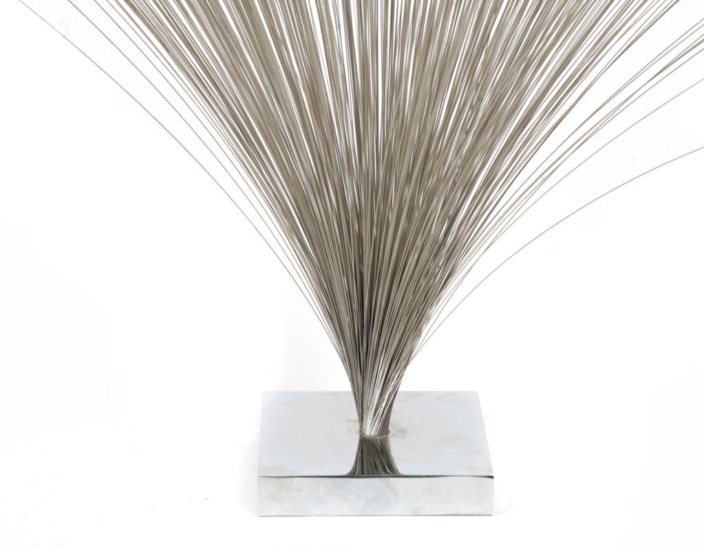Early Harry Bertoia spray sculpture circa late 1960's. Features cleverly placed thin steel rods mounted in a solid steel base. Excellent original condition.