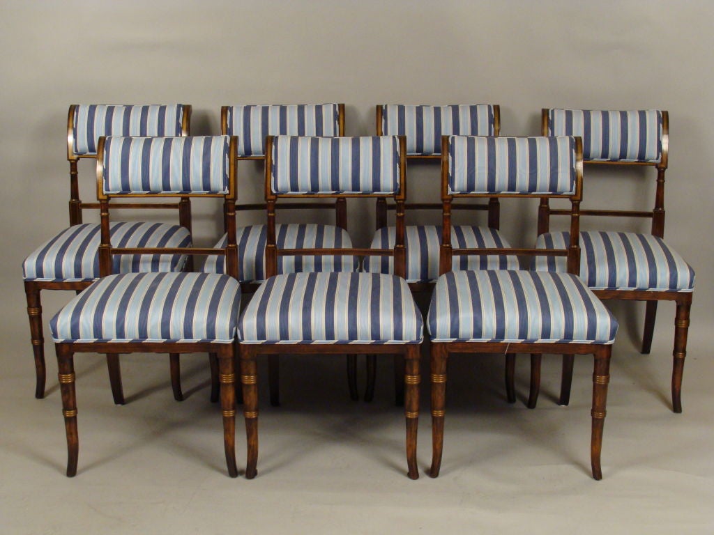 Set of 12 English regency style grain painted rosewood and gilt decorated dining room chairs