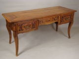 Louis XV provincial  carved fruitwood desk.