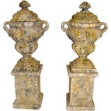 Pair of stone composistion  garden urns on stands