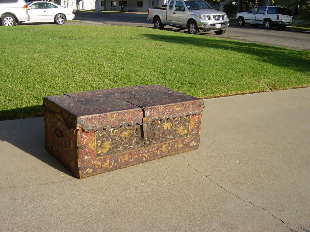 A rare Peruvian 18th century polychrome tooled leather chest<br />
with original painted surface, and forged iron hardware and fittings.