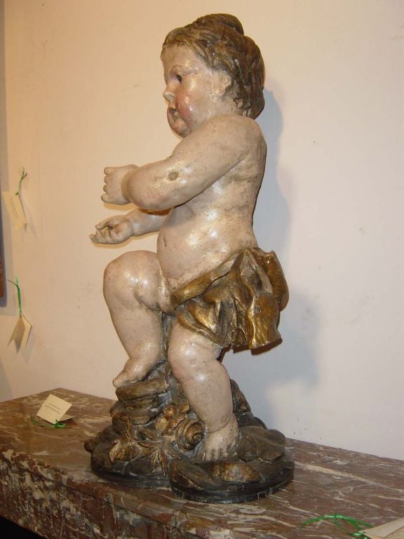 Carved and Polychrome Putto