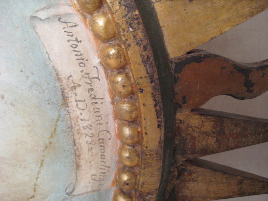 Carved wood sunburst of The Virgin Mary