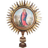 Carved wood sunburst of The Virgin Mary