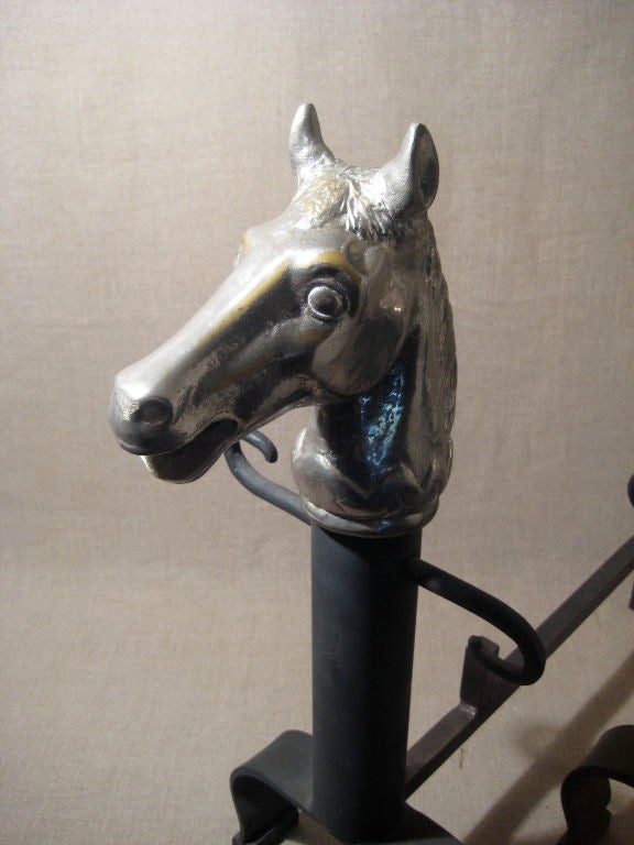 Pair of fireplace irons, with horse heads