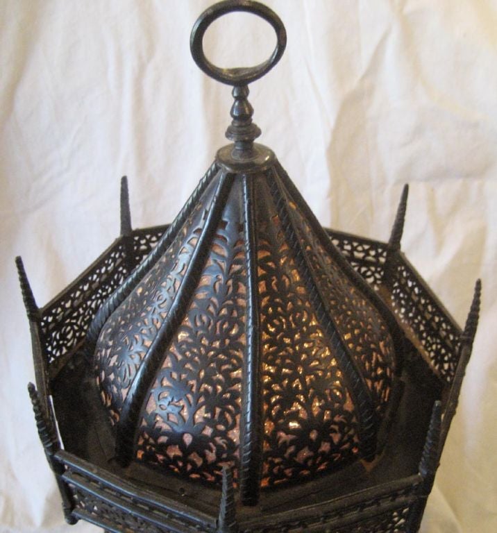 Spanish hand forged iron lamp with a wood base and linen insert.