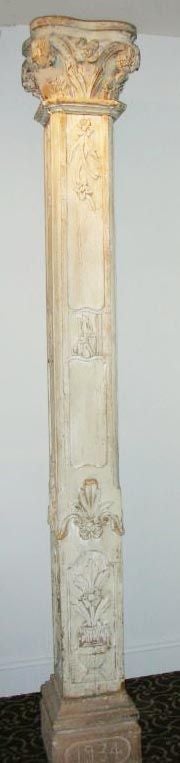Pair of French hand carved wood square columns with carved capitals and (1934) carved stone bases. Purchased at a hotel where the stone bases were added in 1934, but originally from a church. 3 pieces each, stone bases, column body, capital.