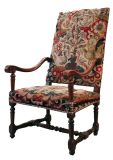 A Louis XIII walnut  armchair with original period needlepoint