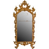 Carved and gilded wood mirror with original gilding and glass.