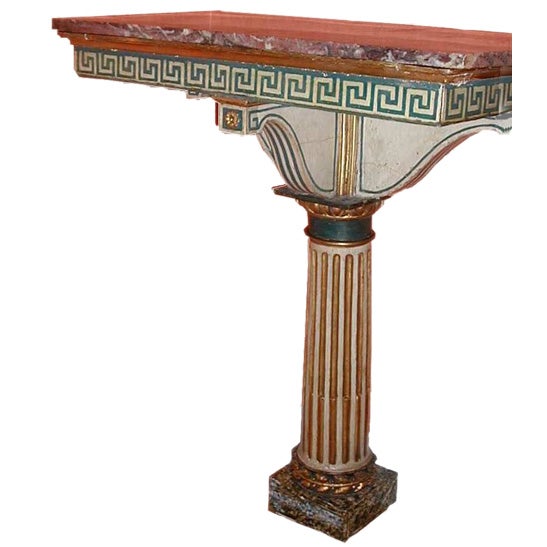 A painted and gilded wood console table with a marble top For Sale