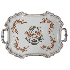 A glazed earthenware tray with handles