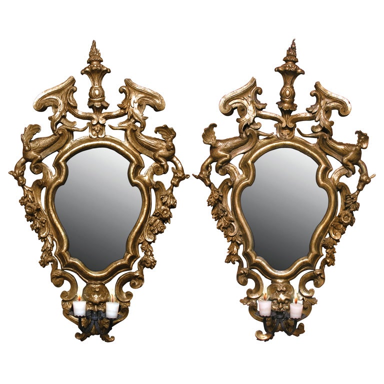 A pair of gilded fir wood mirrors with wrought iron candle arms For Sale