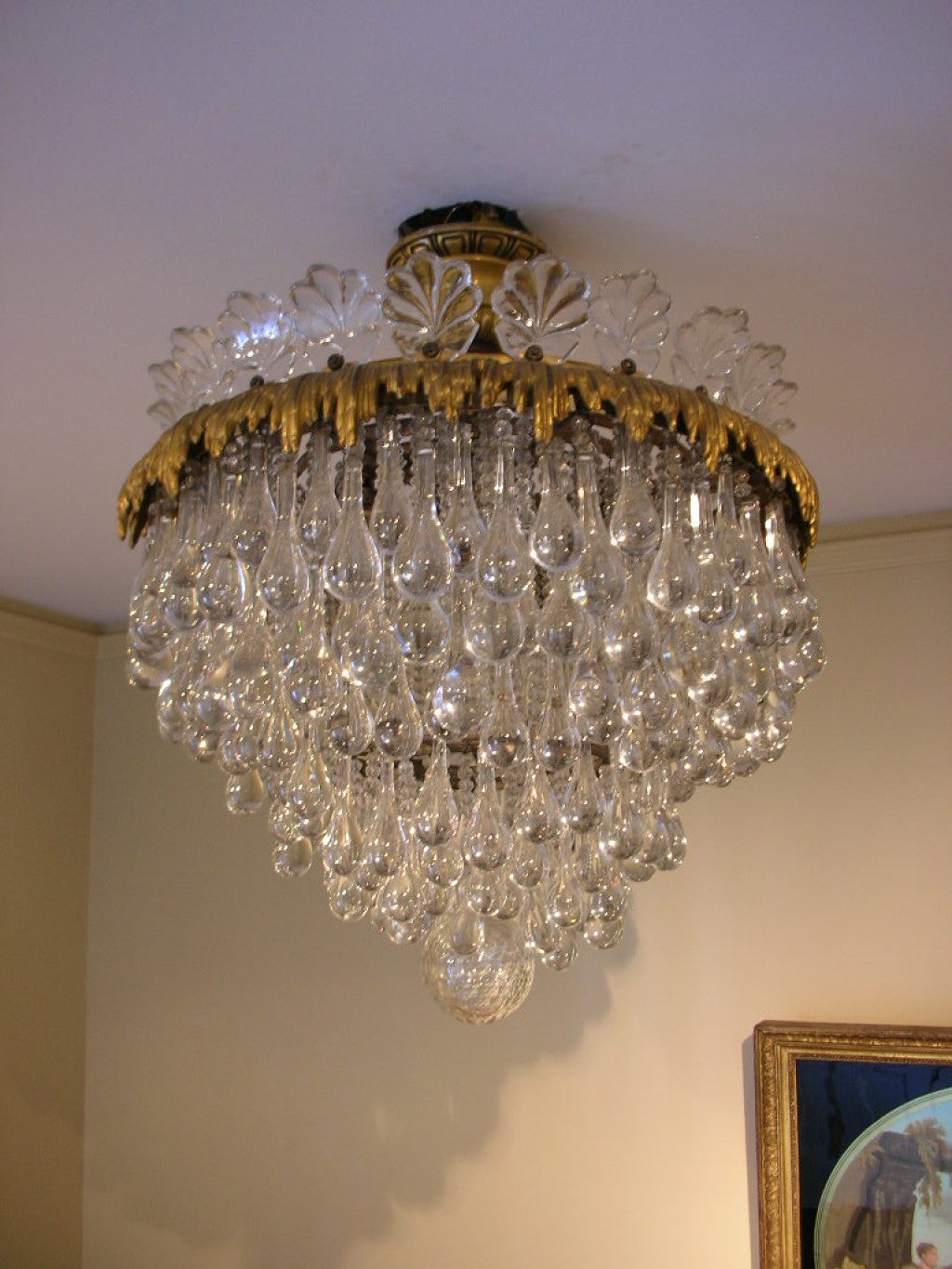 Fine crystal and bronze chandelier, the canope signed with a C in a diamond lozenge. E. F. Caldwell was a fine New York lighting manufacturer from the end of the 19th and beginning of the 20th century. They supplied the lighting for the Waldorf