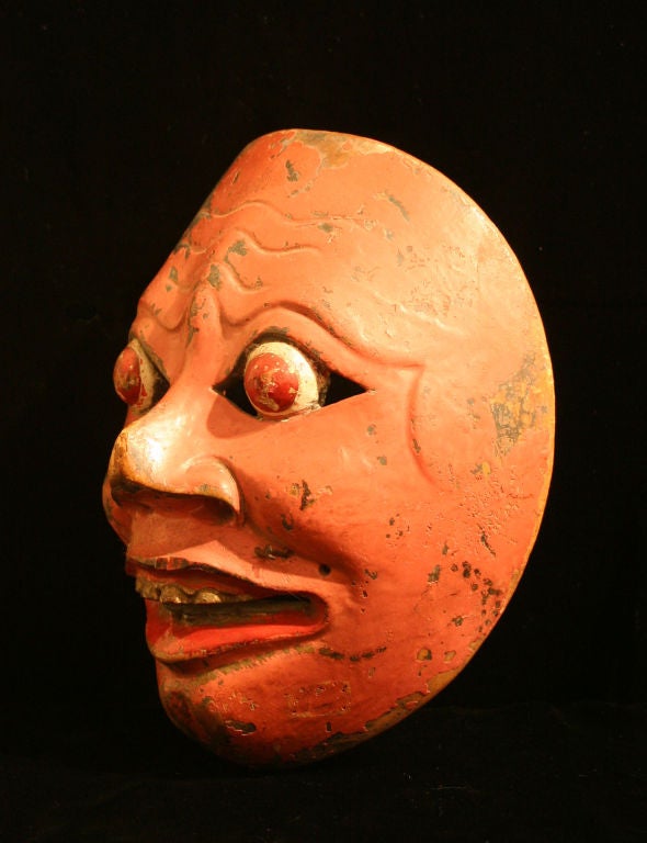 Lively painted wooden dance mask in good condition for its age.