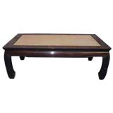 Chinese rosewood table with rattan top.