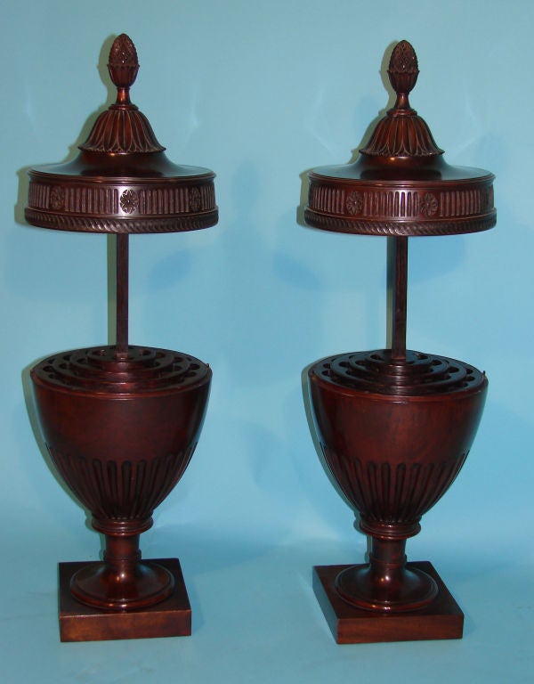 A fine pair of English mahogany Adam style cutlery urns of typical form, circa 1870.