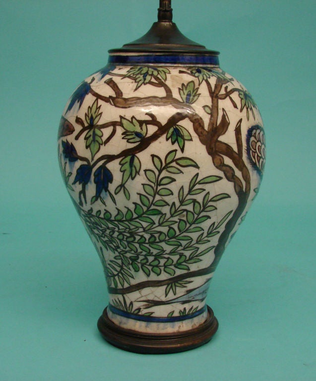 A Persian ceramic vase now mounted as a table lamp, the vase circa 1900.