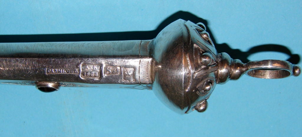 A Russian 84 standard silver Torah pointer, dated 1844. Probably made in Tiflis, Georgia. Inset with unidentified hardstone.