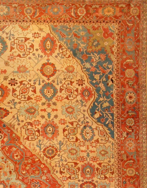 This magnificent and monumental Serapi carpet skillfully blends Classic Northwest Persian medallion design of the Serapi and Heriz tradition with a “harshang” pattern field. Such a combination is extremely rare but highly successful in this