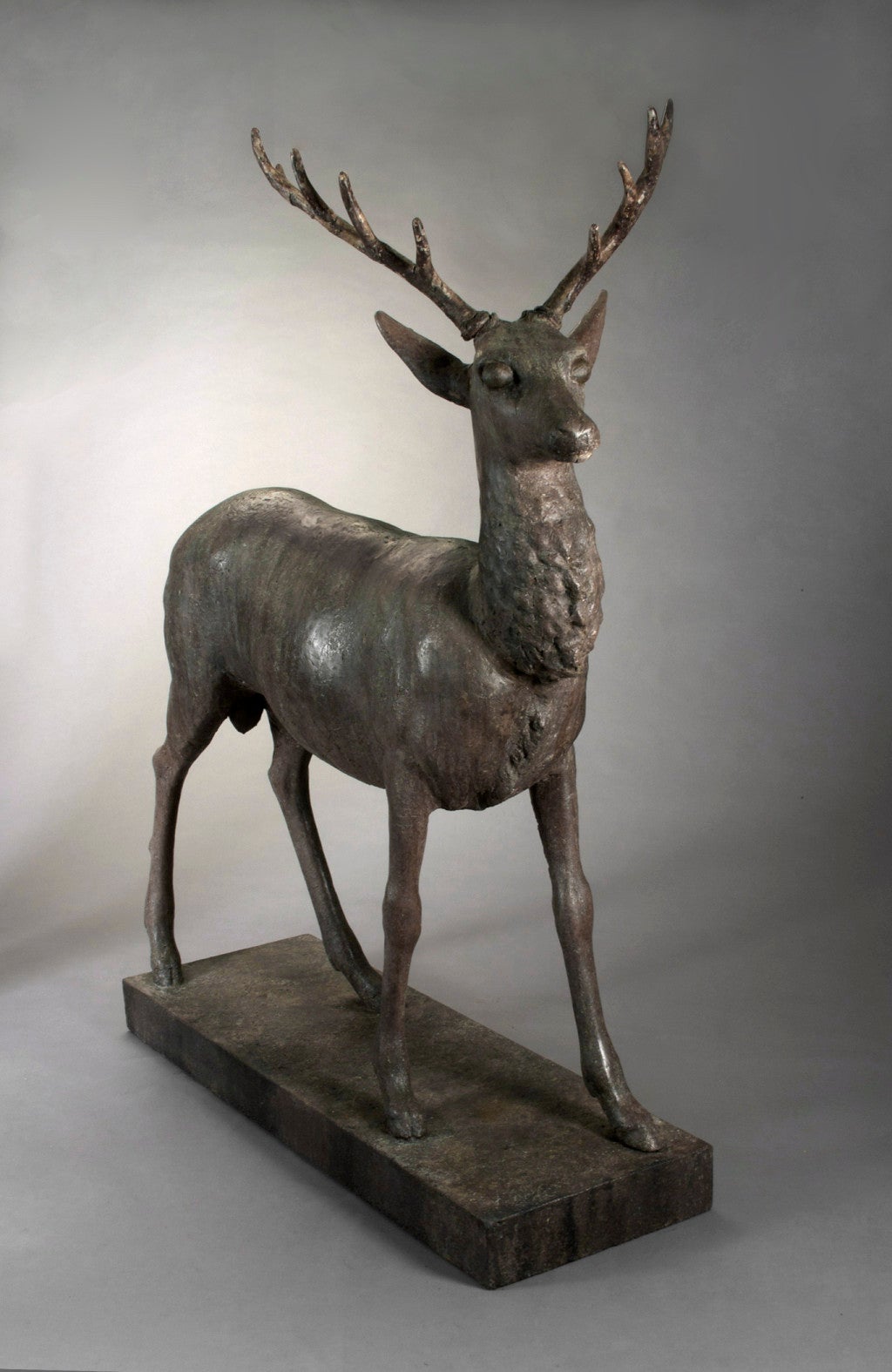 Standing alert with head turned slightly to the right, on a rectangular base.  Attributed to J.W.Fiske & Co.  (1870-1893)  The Fiske company of New York City was one of the leading makers and retailers of ornamental iron and zinc decorations during