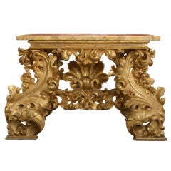 An Italian Baroque Carved Giltwood Console Table