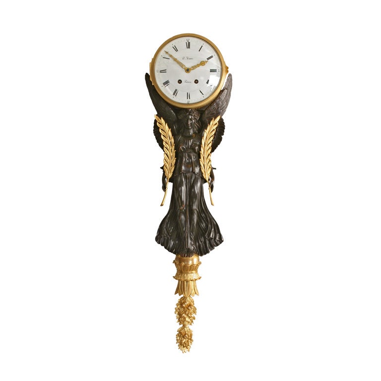 An Empire Gilt and Patinated Bronze Nike Figure Wall Clock