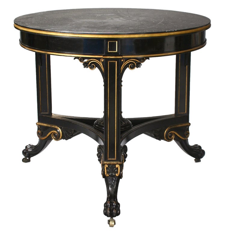 An English Ebonized Center Table by George Trollope & Sons