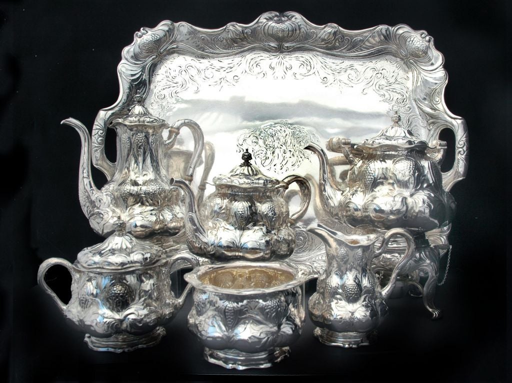 PLEASE VISIT LAUREN STANLEY IN NEW YORK CITY<br />
<br />
A fine circa 1898 martele six (6) piece tea/coffee set with circa 1897 tray by Gorham, of Providence, RI, each hollowware  piece chased in a generous motif of leaves and huckleberries; the