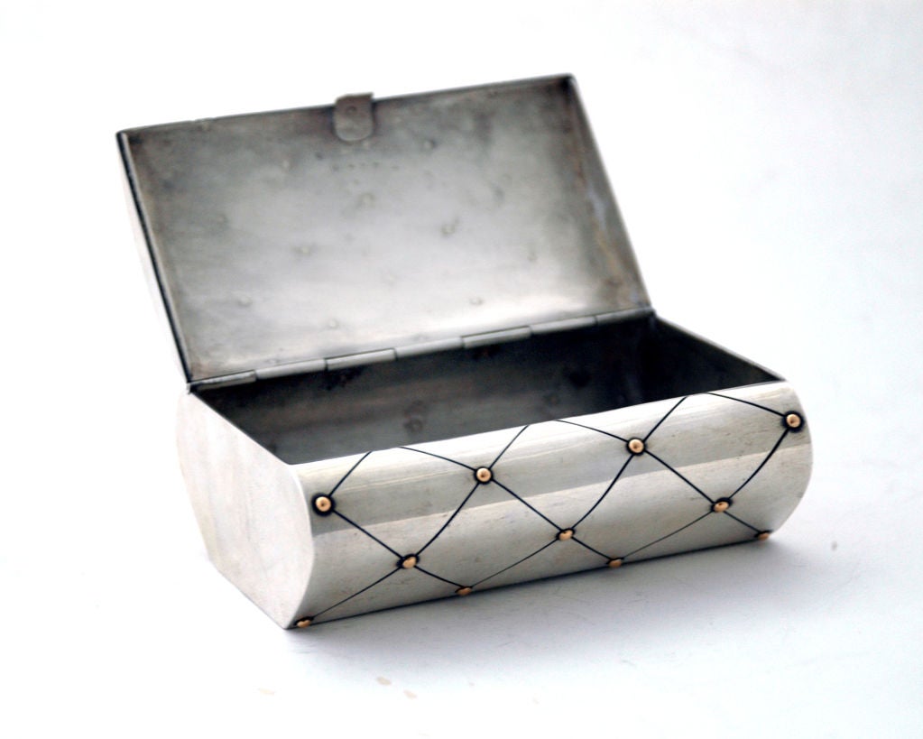 Please visit Lauren Stanley.

A rare, circa 1962 sterling silver and gold beaded evening bag or box by William Spratling, of Taxco, Mexico, box with a flip lid, diamond-shaped engraving with gold dots and flip lid.
Weight 6 oz. Dimensions 3 5/8