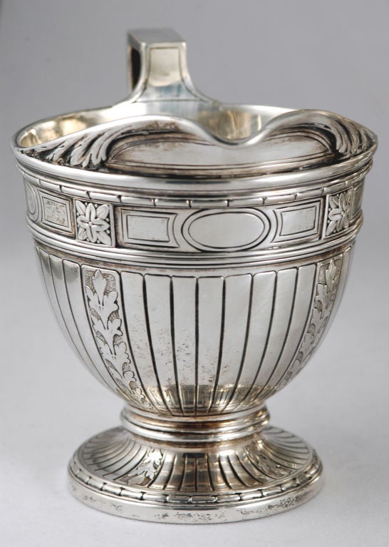 PLEASE VISIT LAUREN STANLEY<br />
<br />
Circa 1909 sterling silver set -- coffee pot, creamer, sugar bowl and tray by Tiffany of New York, in the Beaux Arts motif, comprising vasiform coffeepot, ovoid open sugar bowl and creamer, chased and