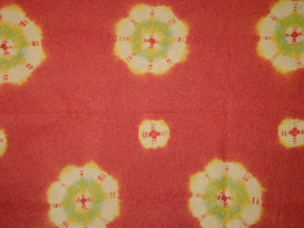 19th century Japanese resist dyed (shibori-zome) wool felt carpet (shibori-mosen) with a red field and resist roundels dyed in light blue and yellow. Called 