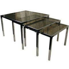 French 1970
s Chrome and Smoked Glass Nesting Tables French 1970
s Chrome and Smoked Glass Nesting Tables