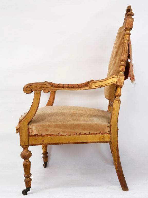 Louis XVI painted open armchair with upholstered seat and back.  Arms are padded.