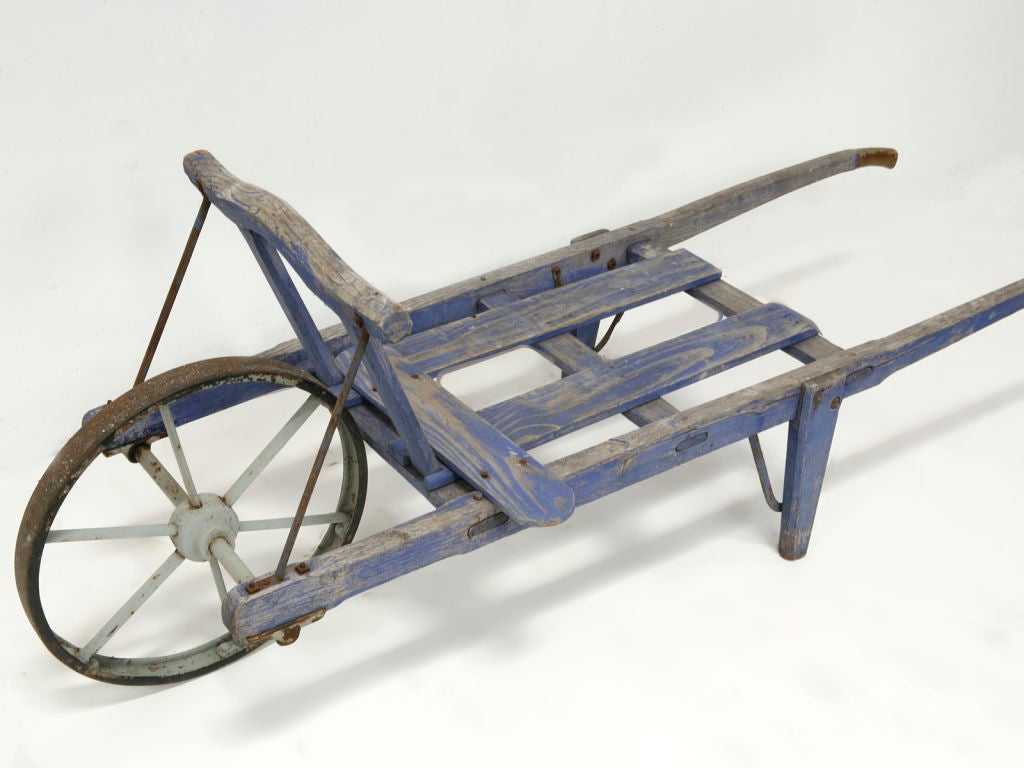 This garden cart, purchased in Rowen, still has remnants of beautiful original blue paint.