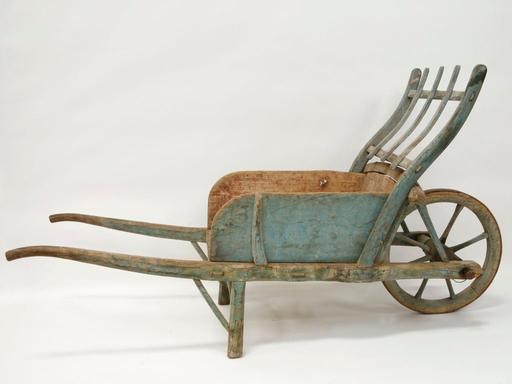 This cart bears a lovely soft blue paint that has aged with a nice patina.