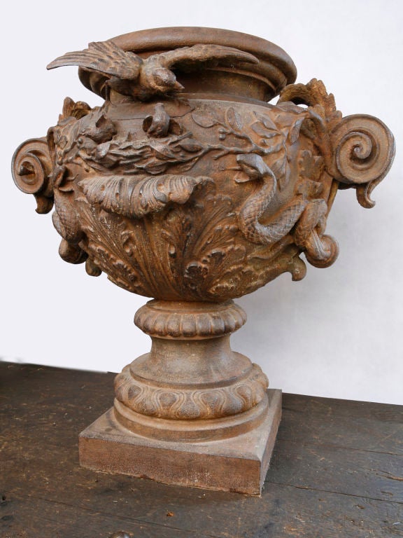 This amazing vase comes from an iron foundry in Paris.  It is intricately adorned with Snakes and birds.