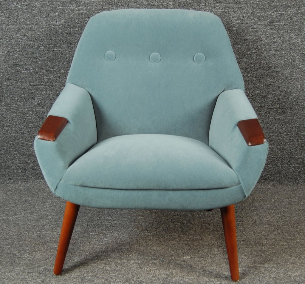 Restored armchair reupholstered and button-tufted in medium turquoise blue wool velvet.  Teak legs and arm rests.<br />
<br />
Fabric swatch available upon request.<br />
<br />
Please contact us with any questions!