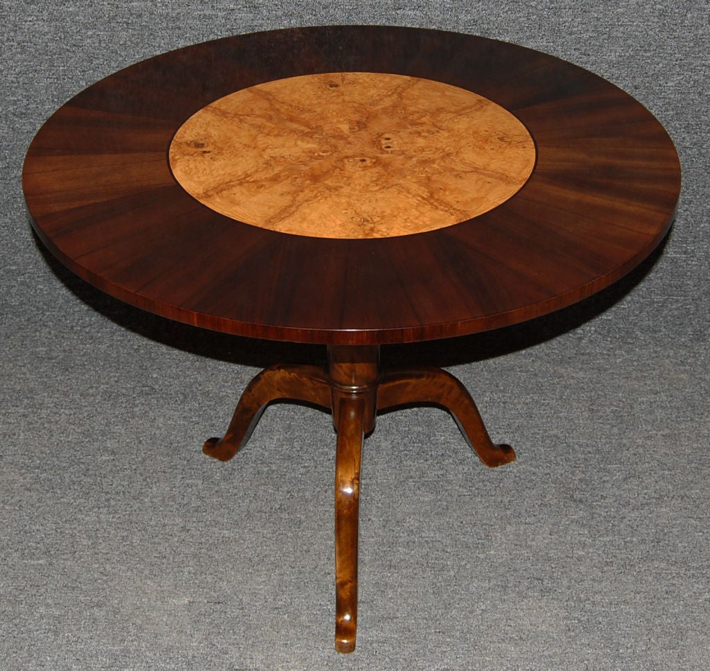 Round pedestal table of Carpathian elm with a rosewood border on a dark flame birch tripod pedestal base.<br />
<br />
Please contact us with any questions!